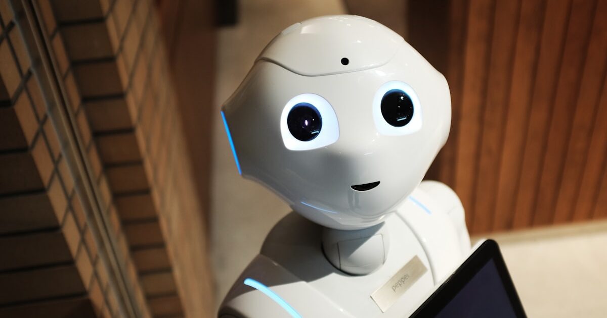 Robotic process automation with robot hand and digital interface representing RPA implementation